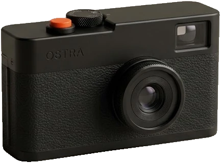 The Ostra 35 in graphite: black anodised top plate, black dial and lens ring, orange release button.