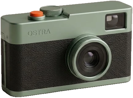 The Ostra 35 in sage: green anodised top plate and lens ring, orange release button.